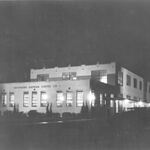 Hoffmann-Hayman Factory at night, 1932
