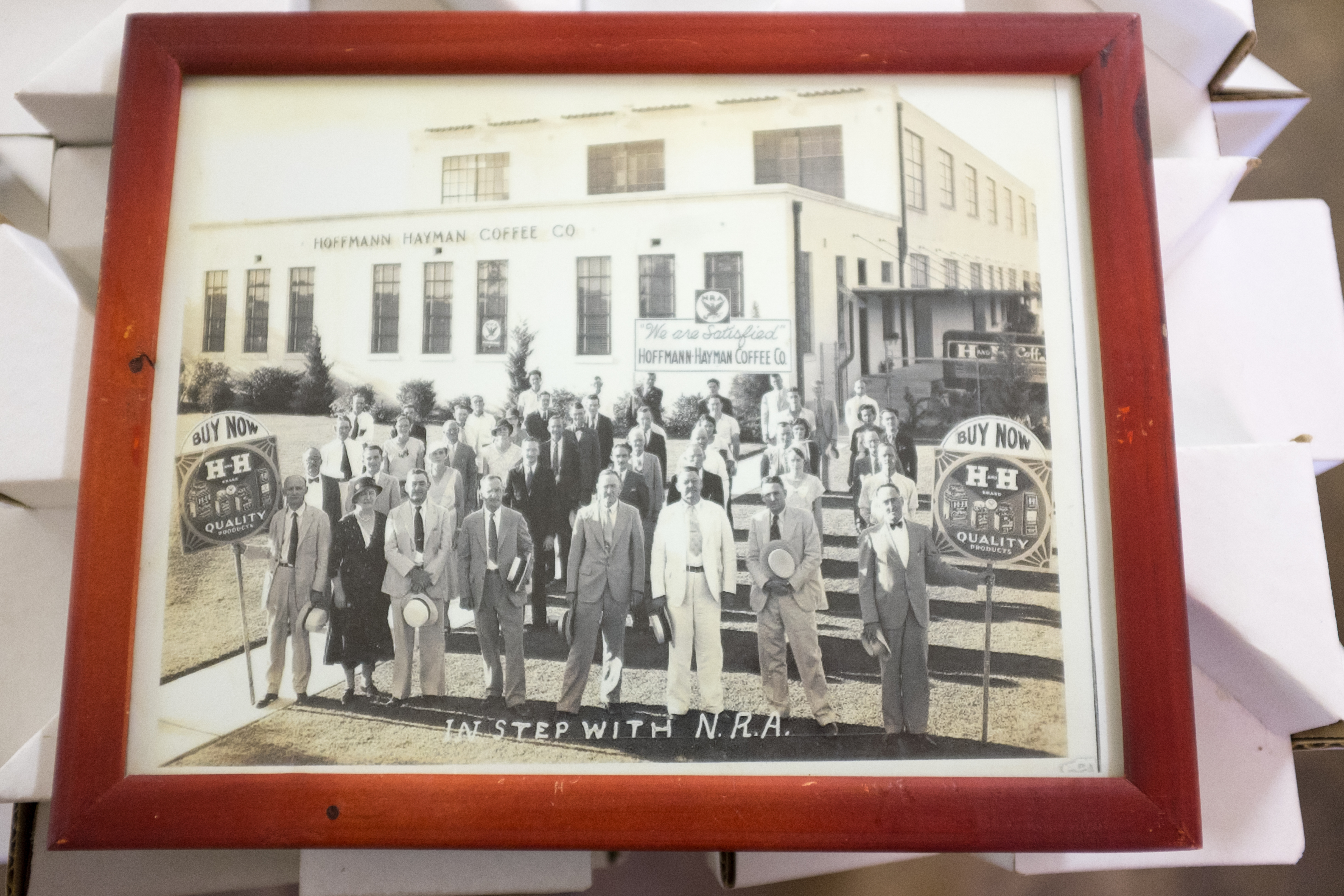 1930s Hoffmann–Hayman factory group photograph, family and staff, delivery vehicle at loading dock, Delaware Street building