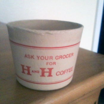 Small cream **paper sampler cup** with **red** rules and display type — **ASK YOUR GROCER** / **FOR** / large **H AND H** with small **AND** between the capitals and **COFFEE** — Hoffmann-Hayman retail ephemera photographed **3 July 2015** on wood against a white wall; **project reference** shot of a disposable sampling form, **not** catalogued as an accessioned museum object in this frame.