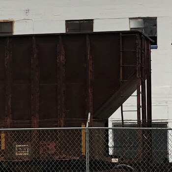 Covered hopper car on the siding behind the factory, 2019