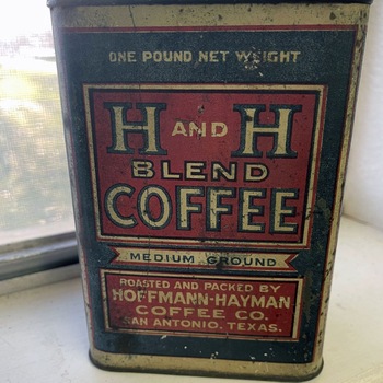 One-pound rectangular H and H Blend Coffee tin, Medium Ground — red label with cream block letters on a dark field, marked 'Roasted and Packed by Hoffmann-Hayman Coffee Co., San Antonio, Texas' and 'One Pound Net Weight' — from the Mac Johanson collection