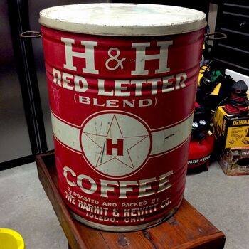 Large cylindrical vintage coffee tin — **red** shell with white **H &amp; H** wordmark, arched **RED LETTER** and **(BLEND)**, central roundel with star and **H**, **COFFEE** in block serif; base band *Roasted and Packed by the **Harnit &amp; Hewitt Co. Toledo, Ohio*** — unrelated **H &amp; H** initial collision with Hoffmann-Hayman San Antonio; friction lid with bail ears; workshop background.