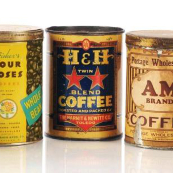 Three vintage coffee tins on white — **center**: **Harnit &amp; Hewitt Co., Toledo** — dark label with large yellow **H&amp;H**, red stars, **TWIN BLEND COFFEE**, banner *Roasted and Packed by the Harnit &amp; Hewitt Co. Toledo* — unrelated **H&amp;H** initial collision with Hoffmann-Hayman San Antonio; **left** Fisher's Four Roses Whole Bean; **right** AM Brand — shelf comparison context only.