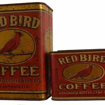 Two rectangular lithographed **Red Bird Coffee** tins — maroon field, arched **RED BIRD** wordmark, cardinal on a branch in an oval, **COFFEE** block type; base reads **REINHARD COFFEE &amp; TEA CO.** / **SAN ANTONIO, TEX.** — contemporary San Antonio roaster packaging, **not** Hoffmann-Hayman H and H; taller tin left, shorter wide tin right; rust and wear. See [Red Bird one-pound tin](/red-bird-coffee-tin-one-pound/).
